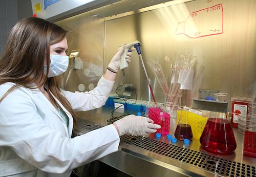 Female working in lab.