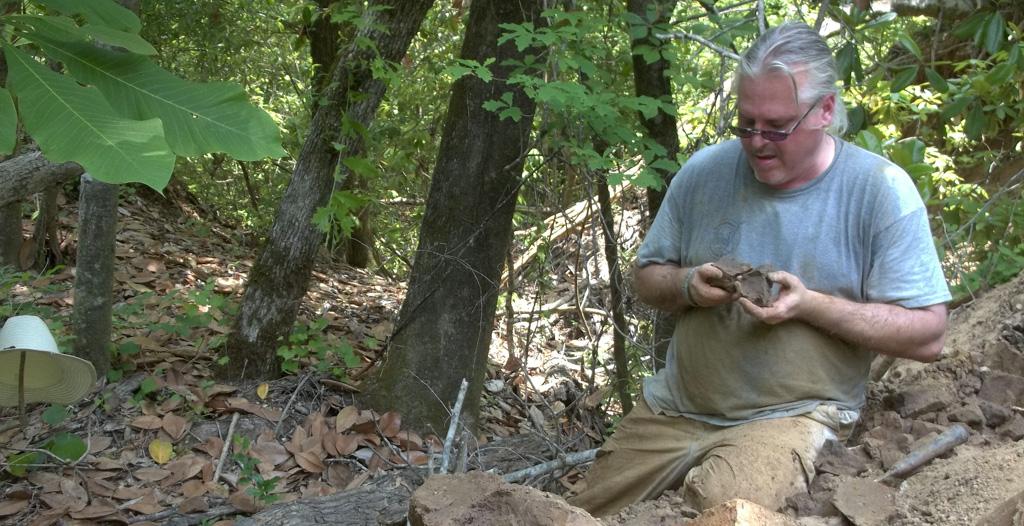 USA biology professor Dr. Brian Axsmith shown here working in Monroe County, AL. circa 2013, has been posthumously honored with the naming of a previously undescribed species of passionflower that he discovered. It is the fourth time Axsmith has had a fossil named after him. 