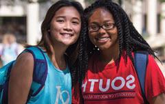 TWo female students in South shirts smiling